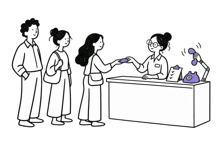 A hospital receptionist hands a token to a patient while a robot hand answers a ringing phone