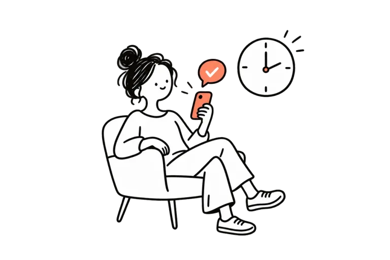 A patient on an armchair reading an appointment reminder on a phone